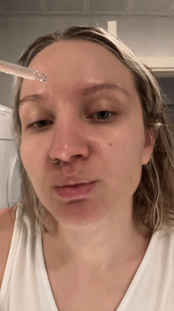 Woman's skincare routine documented in Esenyurt, Turkey bathroom