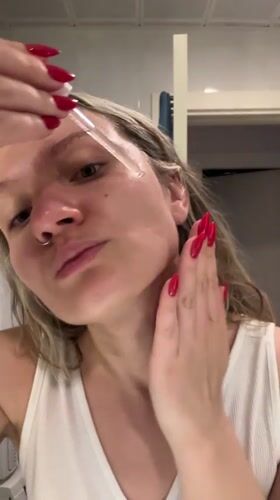 Woman's skincare routine documented in Esenyurt, Turkey bathroom