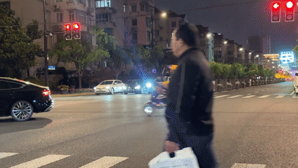 Evening street activity captured at Shanghai intersection