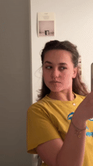 Woman records mirror selfies in Milan apartment Thursday evening