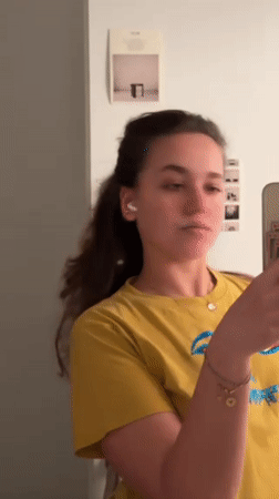 Woman records mirror selfies in Milan apartment Thursday evening
