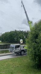 Construction crane operates near waterfront park in Kazan