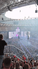 Stadium concert in full swing with pyrotechnics and lasers