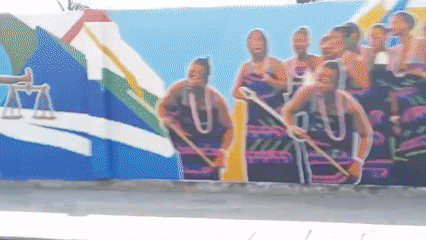 Street scenes documented in Badagry Nigeria including murals government building