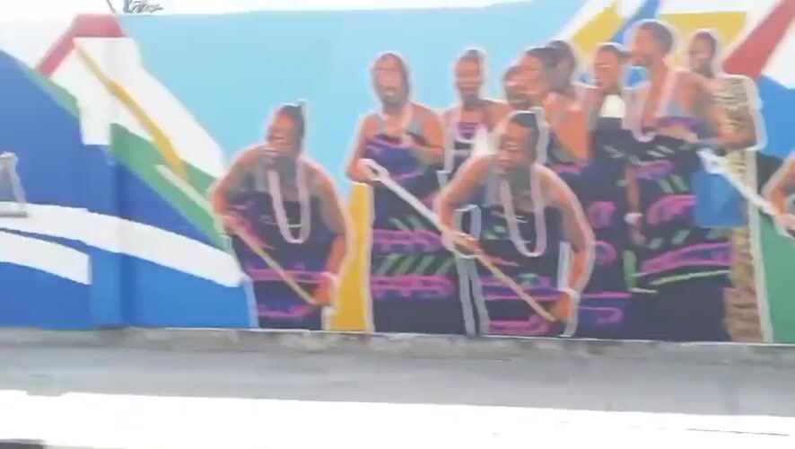 Street scenes documented in Badagry Nigeria including murals government building