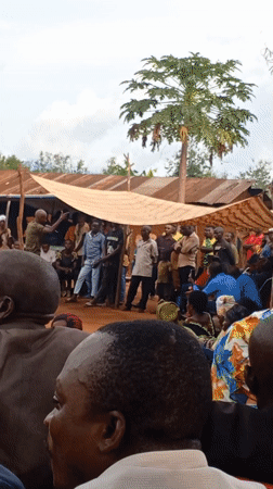 Community gathering with speeches and traditional dancing in DRC villages