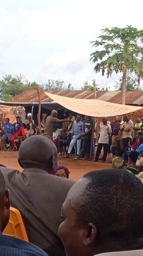 Community gathering with speeches and traditional dancing in DRC villages