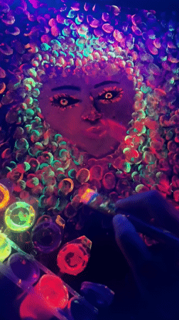 Artist creates blacklight portrait with colorful dots in Mozhga