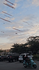 Daily life unfolds across Denpasar: kites, beaches, families