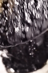 Dhaka resident prepares dark viscous liquid with spheres