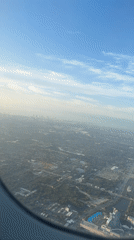 Aerial view captures Dania Beach landscape from airplane window