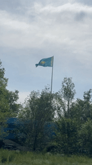 Kazakhstani flag flies in windy conditions in Astana