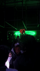 Green-lit venue with illuminated screen observed in Paris