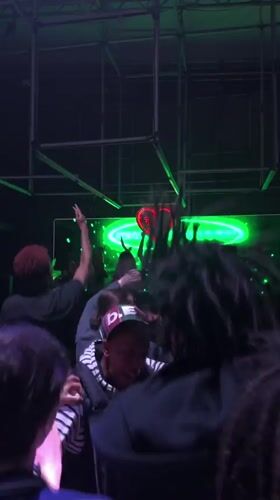 Green-lit venue with illuminated screen observed in Paris