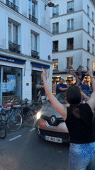 Flag-waving celebration draws crowds to Paris street