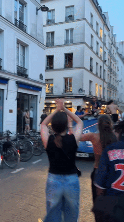 Flag-waving celebration draws crowds to Paris street