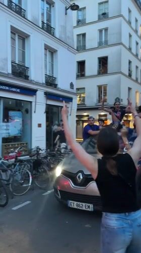 Flag-waving celebration draws crowds to Paris street