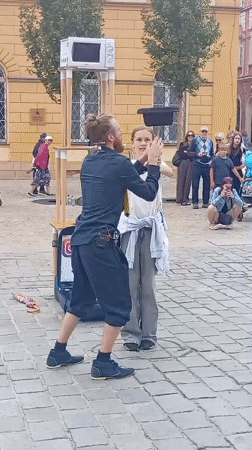 Street performers entertain on Wrocław's cobblestone plaza