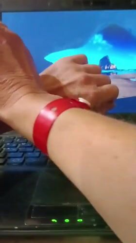 Late-night #WristCheck post featuring a red bracelet in Kommunarka