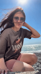 Woman enjoys sunny day on Sochi beach