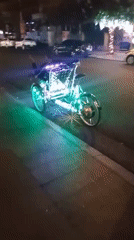 Illuminated pedicab spotted on Nha Trang street at night