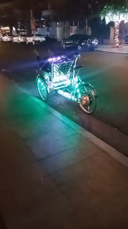 Illuminated pedicab spotted on Nha Trang street at night