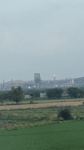Industrial complex observed from agricultural fields in El Llano