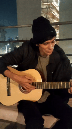 Late-night acoustic guitar session in Providencia, Santiago