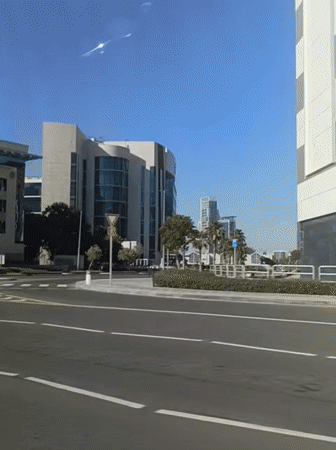 Vehicle journey through Dubai streets captured in daytime footage
