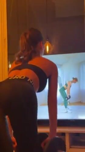 Woman conducts home workout session in Tel Aviv