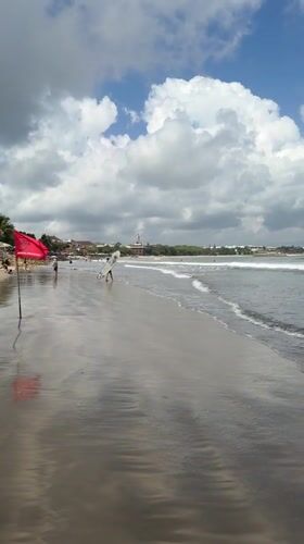 Beach, surf shops, and coconuts in Kuta, Bali
