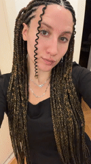 Woman takes selfies in Munich wearing black outfit