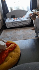 Child dances in Moscow living room with music speaker