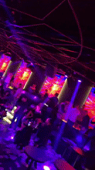 Nightclub scene captured in Sofia with DJ, screens, crowds