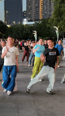 Group performs synchronized dance in Liangjiang public square