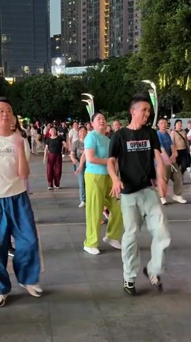 Group performs synchronized dance in Liangjiang public square