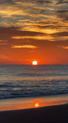 Surfboard and sunrise at Arugam Bay's shoreline