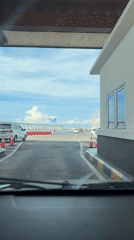Driver records toll booth passage in Kuta traffic