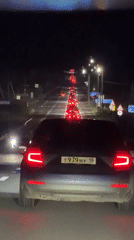 Driver documents nighttime traffic congestion from car interior