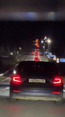Driver documents nighttime traffic congestion from car interior