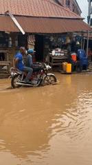 Ihiagwa residents navigate flooded streets during daily activities