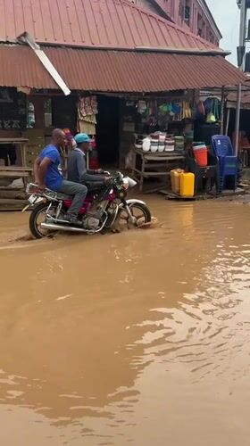 Ihiagwa residents navigate flooded streets during daily activities