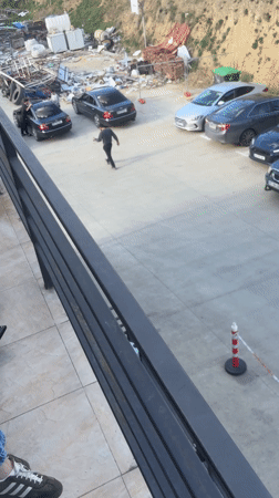Person films parking lot from platform in Tbilisi