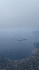 Overcast skies obscure aerial view of Antibes coastline