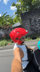 Motorcyclist films selfie video while riding in North Kuta