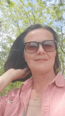 Morning park visit captures woman, nature details, toy tractor