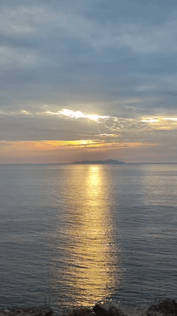 Sunrise over Nha Trang bay, clouds, geckos, and scattered trash