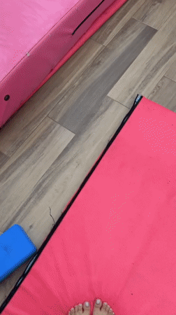 Late-night aerial yoga session captured in San Andrés Cholula studio