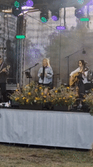 Live music and local crowds at an outdoor Priekule gathering