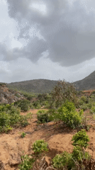 Rural Nigerian landscape documented under cloudy afternoon skies